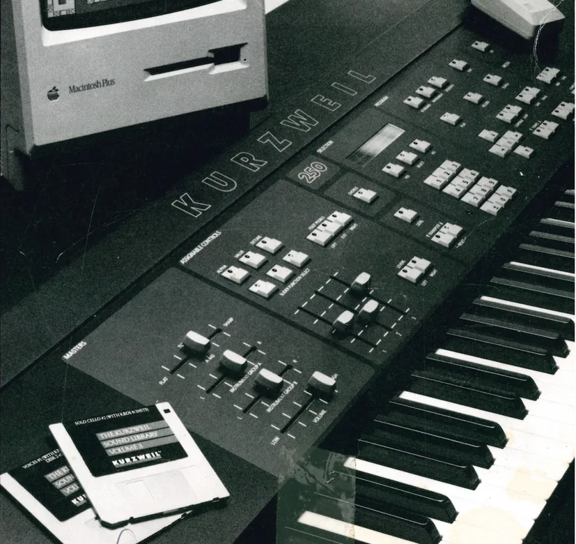 Kurzweil 250 synthesizer keyboard with computer monitor showing waveform display